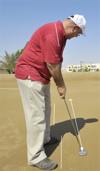 Gulf Weekly Stan works on the fine art of his short game